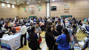 Broad view of job seekers and employers connecting at the 2025 Tustin Career Fair