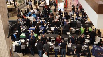 Bird's eye view of job seekers and employers connecting at the 2025 Brea Career Fair