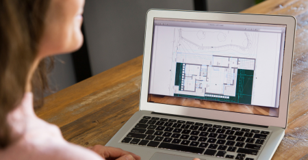 Woman using outdoor planning software on laptop