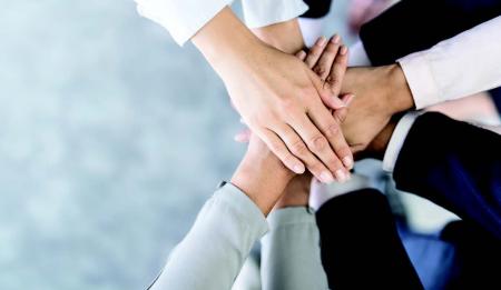 hands gathered together to network