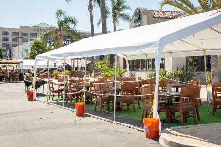 A view of an vacant outdoor tent patio seating area for a local El Torito restaurant, during the pandemic.