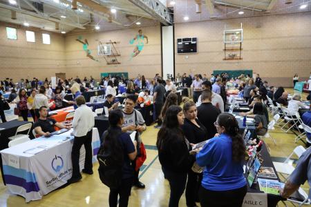 Broad view of job seekers and employers connecting at the 2025 Tustin Career Fair