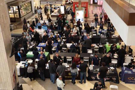 Bird's eye view of job seekers and employers connecting at the 2025 Brea Career Fair